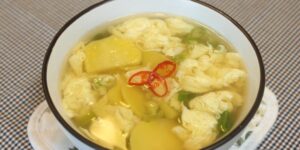 Boiling egg potato soup Making clear soup